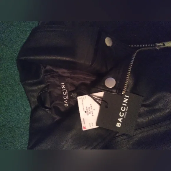 It is a leather jacket, with wool arms. - Picture 2 of 2